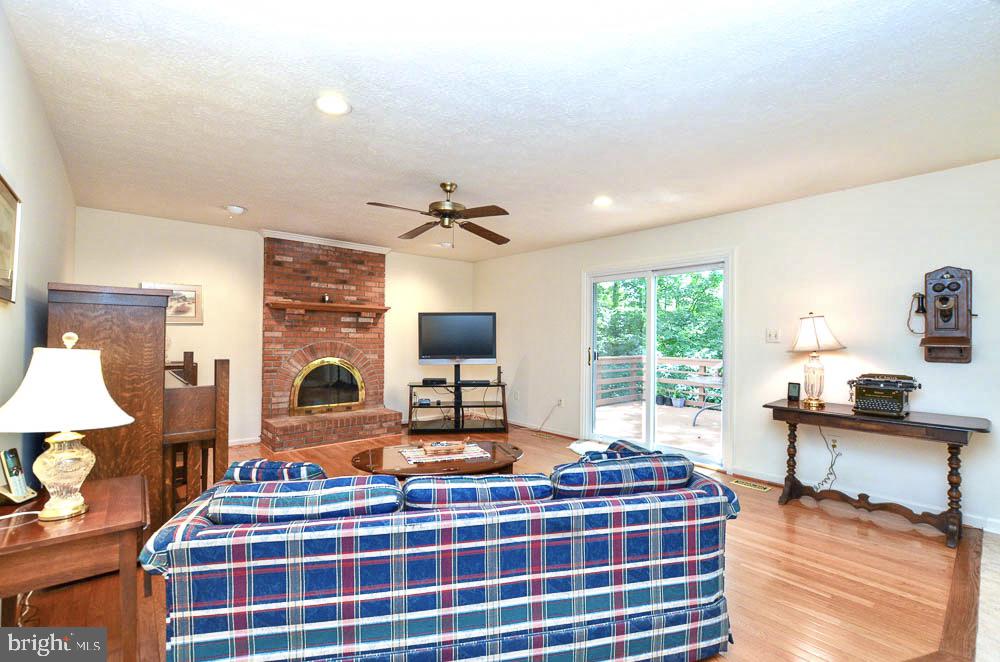 18 Carrollton Road Sterling, VA 20165 - Photo 16 of 45 Brick hearth fireplace w/Heatilator warms the FR