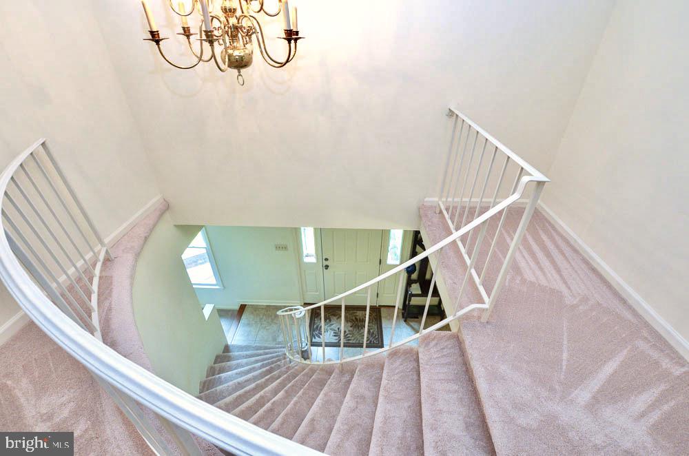 18 Carrollton Road Sterling, VA 20165 - Photo 20 of 45 View down of foyer from spiral staircase