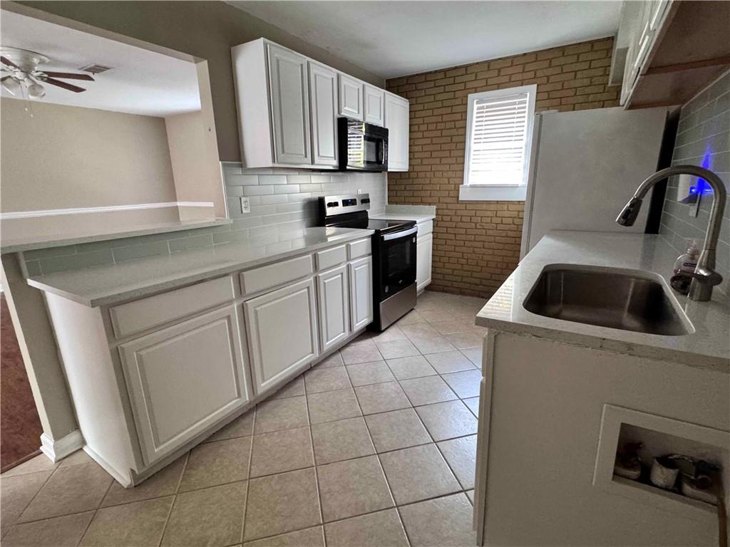 3091 Colonial Way, Unit 3 Atlanta, GA 30341 - Photo 11 of 34 a kitchen with cabinets and sink