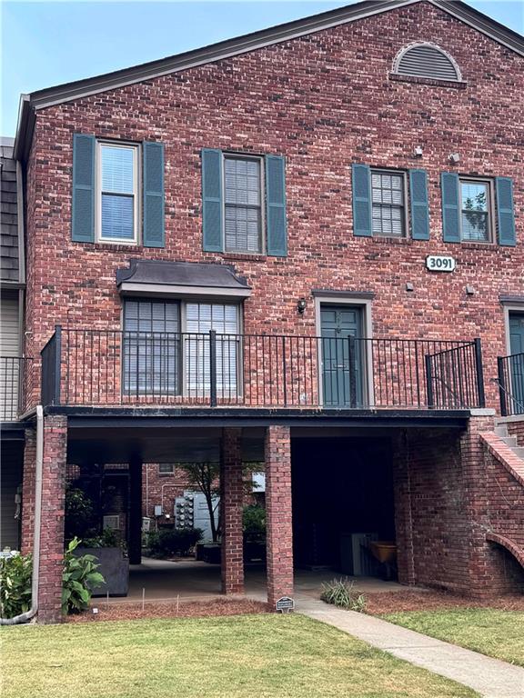 3091 Colonial Way, Unit 3 Atlanta, GA 30341 - Photo 2 of 34 a building with potted plants in front of it