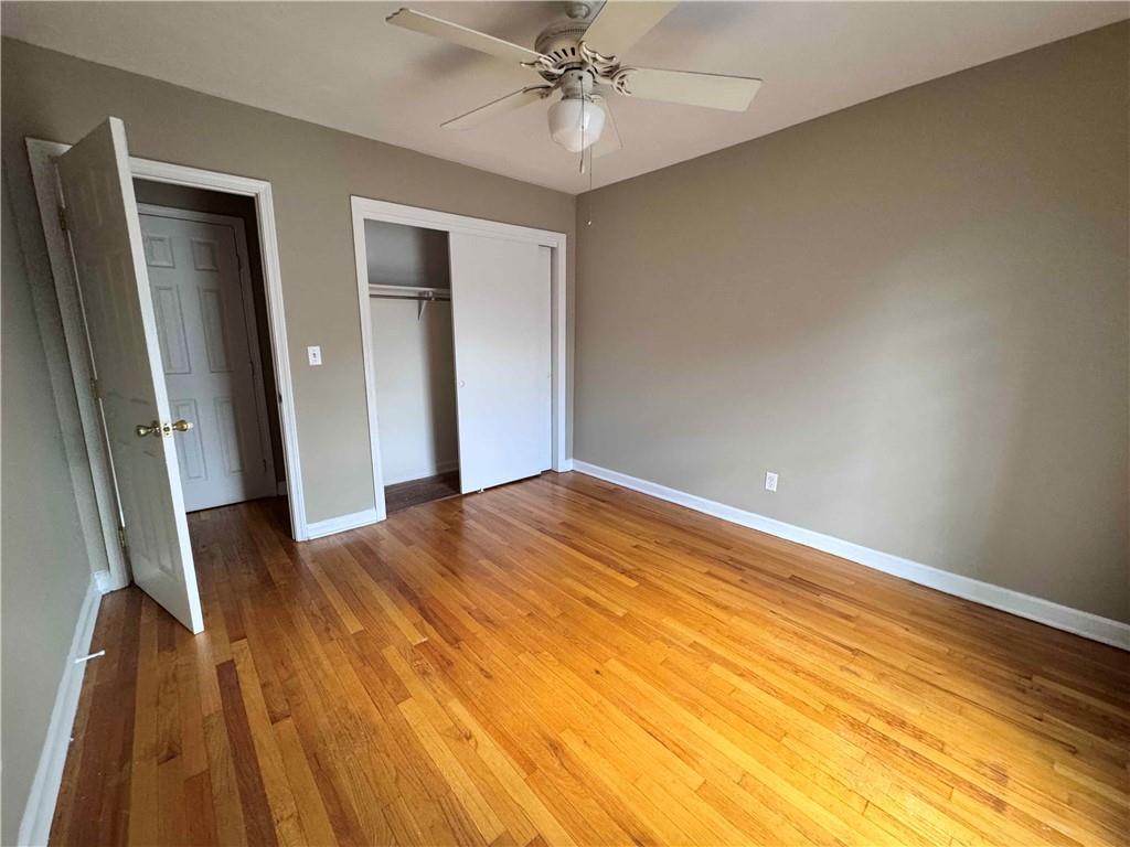 3091 Colonial Way, Unit 3 Atlanta, GA 30341 - Photo 25 of 34 wooden floor in an empty room with a window