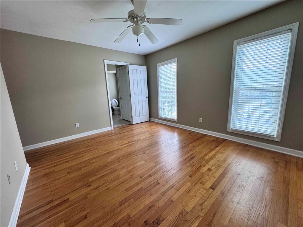 3091 Colonial Way, Unit 3 Atlanta, GA 30341 - Photo 28 of 34 a view of an empty room with wooden floor and a window