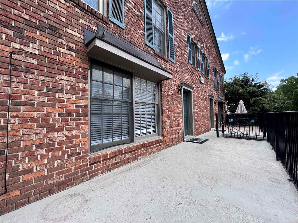 3091 Colonial Way, Unit 3 Atlanta, GA 30341 - Photo 5 of 34 a view of a brick building with many windows