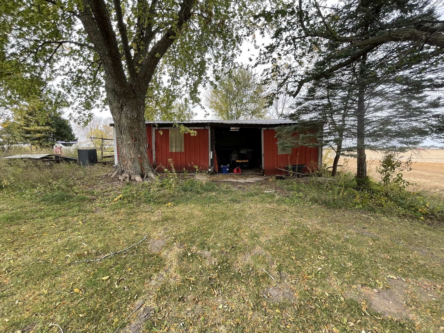 799 Searls Road Amboy, IL 61310 - Photo 8 of 23 a view of outdoor space with garden and trees