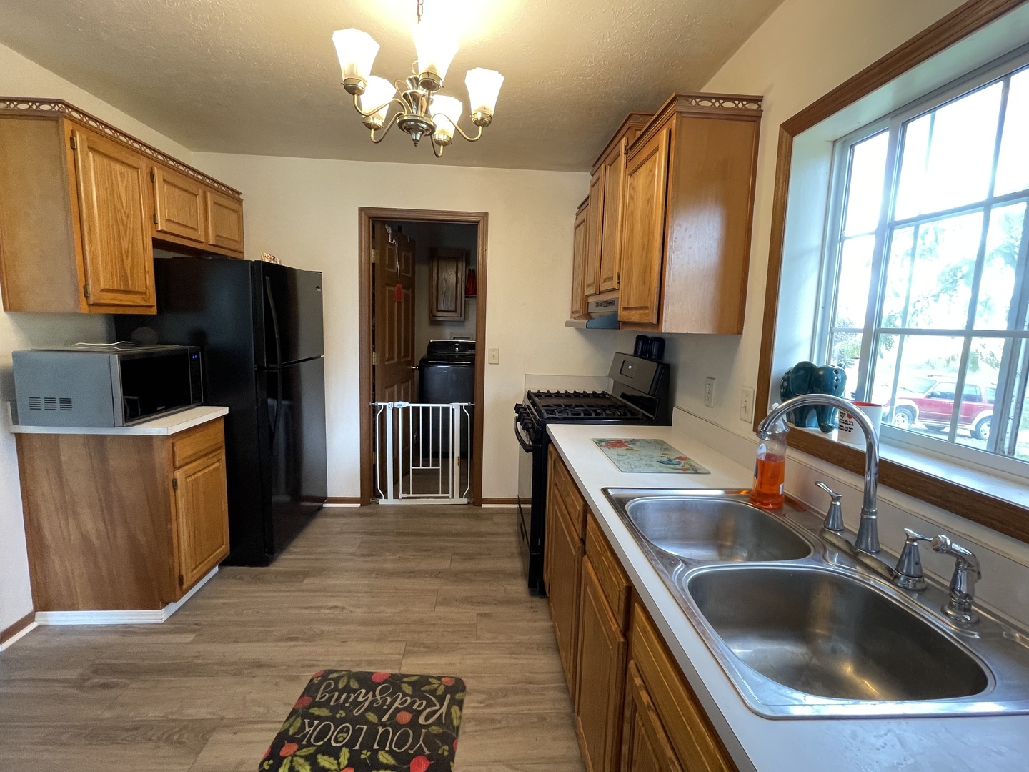 799 Searls Road Amboy, IL 61310 - Photo 9 of 23 a kitchen that has a sink and a stove