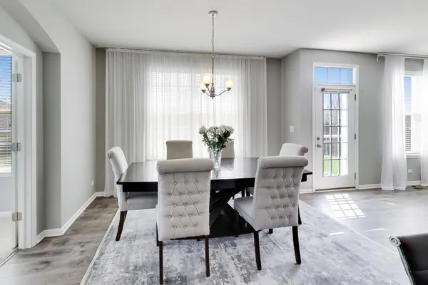 a dining room with furniture and window