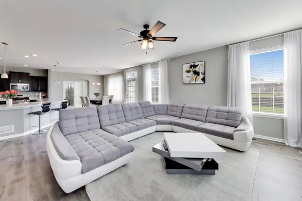 a living room with furniture and a large window