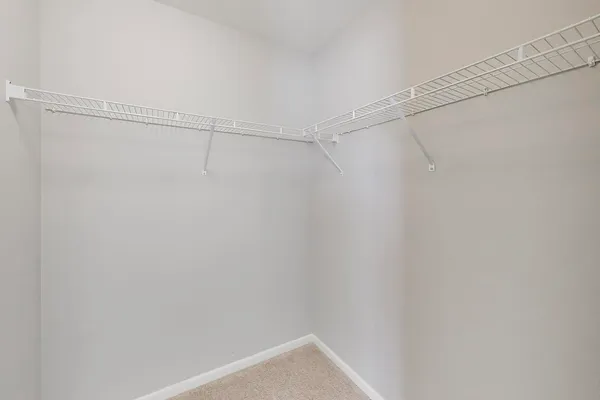 a view of a room with shelf on the wall