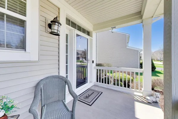 a view of balcony with furniture