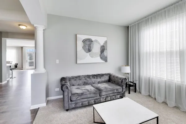 a living room with furniture and a window