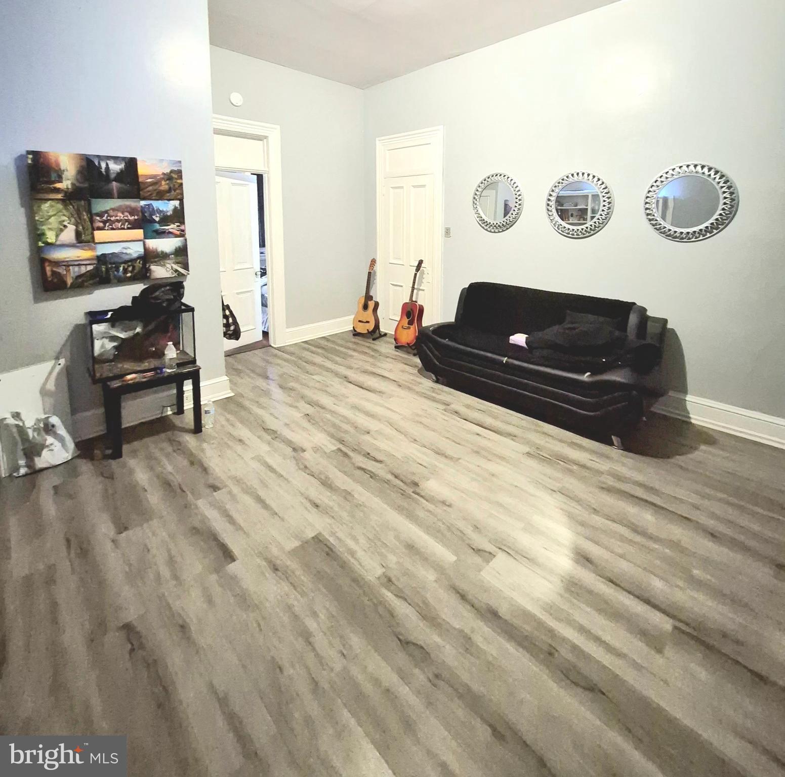 220 North 6th Street Reading, PA 19601 - Photo 16 of 30 a living room with furniture and a window