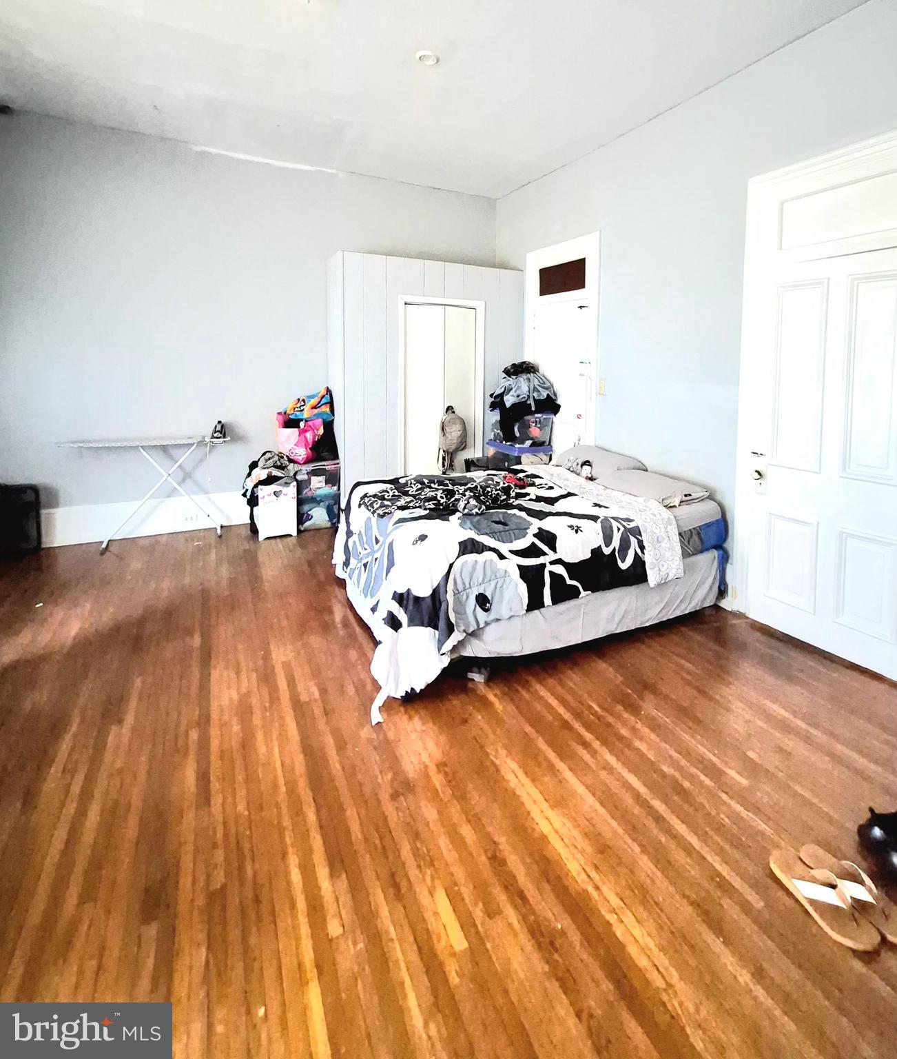220 North 6th Street Reading, PA 19601 - Photo 18 of 30 a bedroom with a bed and wooden floor