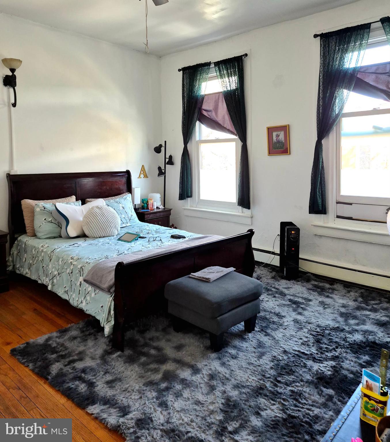 220 North 6th Street Reading, PA 19601 - Photo 9 of 30 a bedroom with bed and a window