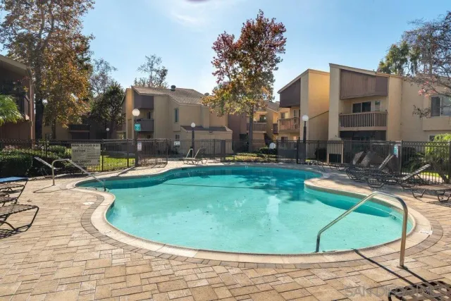 a view of swimming pool with outdoor seating