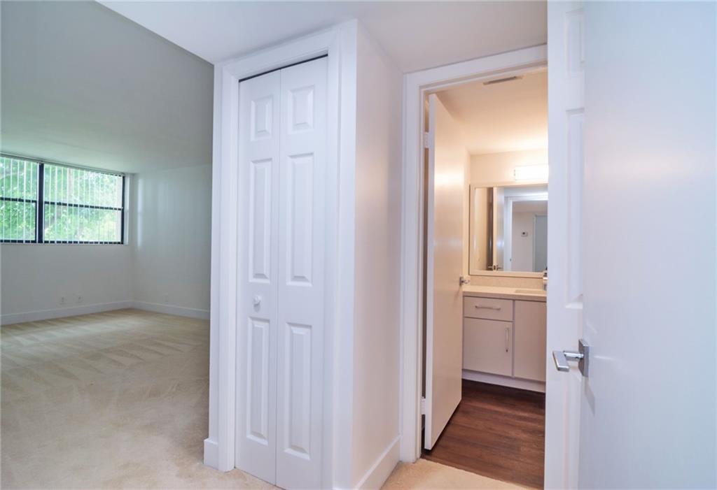 491 Racquet Club Road, Unit 212 Weston, FL 33326 - Photo 13 of 27 a view of a bathroom from the hallway