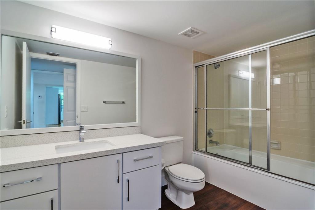 491 Racquet Club Road, Unit 212 Weston, FL 33326 - Photo 14 of 27 a bathroom with a shower sink vanity mirror and toilet