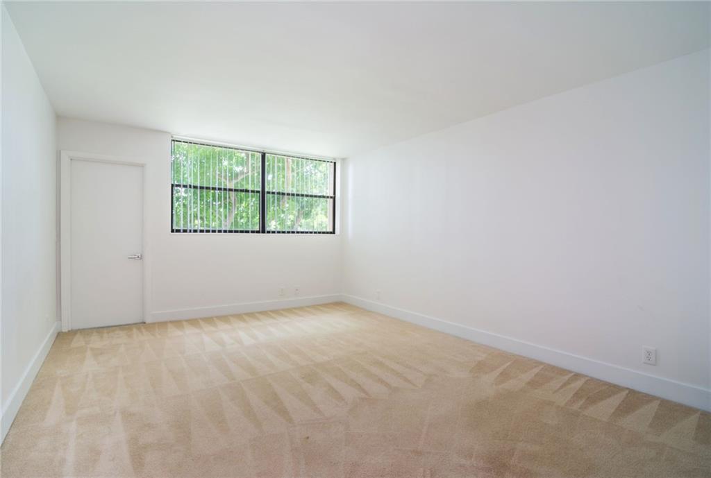 491 Racquet Club Road, Unit 212 Weston, FL 33326 - Photo 15 of 27 an empty room with a window