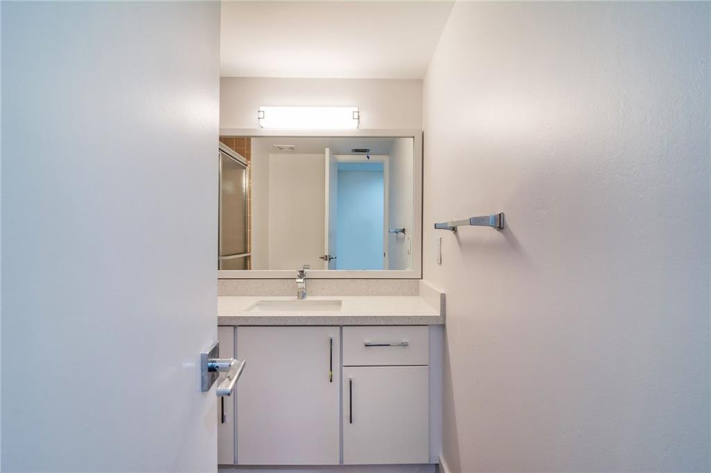 491 Racquet Club Road, Unit 212 Weston, FL 33326 - Photo 19 of 27 a bathroom with a sink and a mirror