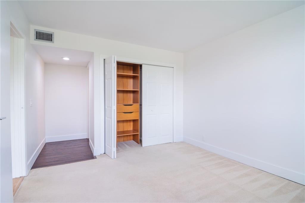 491 Racquet Club Road, Unit 212 Weston, FL 33326 - Photo 20 of 27 a view of an empty room with a closet