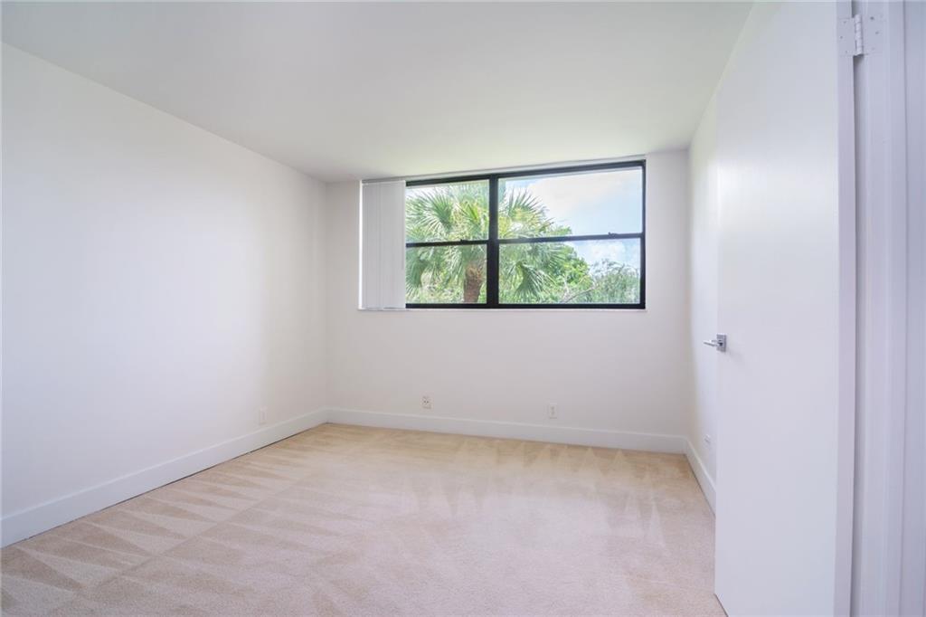 491 Racquet Club Road, Unit 212 Weston, FL 33326 - Photo 21 of 27 an empty room with a window