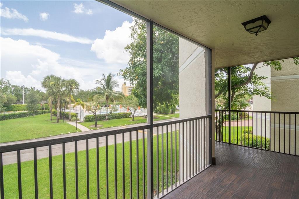 491 Racquet Club Road, Unit 212 Weston, FL 33326 - Photo 22 of 27 a view of a city street from a balcony