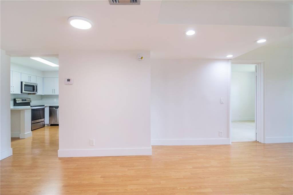 491 Racquet Club Road, Unit 212 Weston, FL 33326 - Photo 5 of 27 a view of kitchen with microwave and cabinets