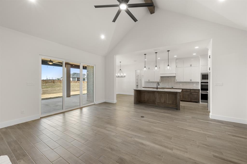 4867 Prairie Sky Lane DISH, TX 76247 - Photo 9 of 27 a view of kitchen with wooden floor and window