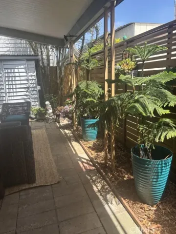 a kitchen with stainless steel appliances granite countertop a refrigerator a stove and a sink