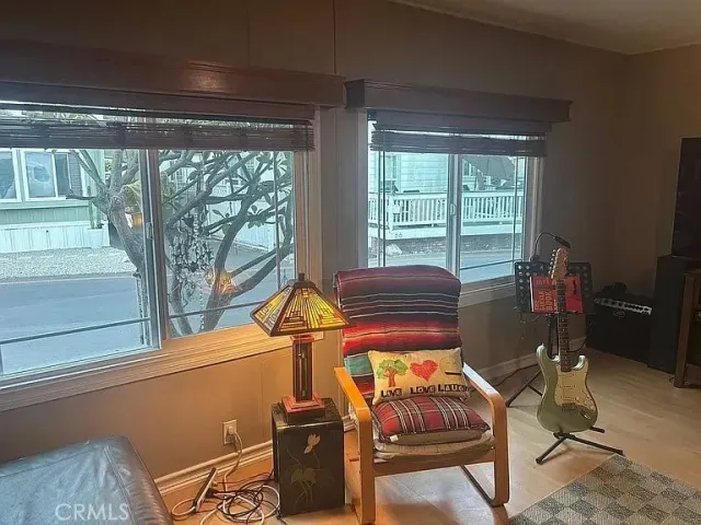 a bedroom with a bed window and couch