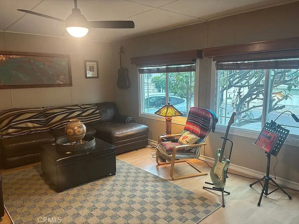 6550 Ponto, Unit 76 Carlsbad, CA 92011 - Photo 16 of 25 a living room with furniture and a large window