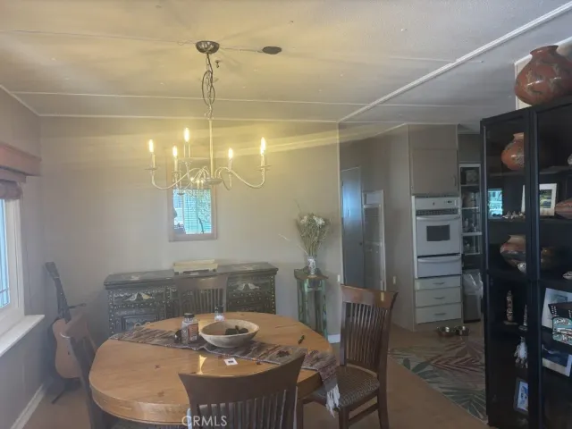 a bedroom with a bed window and couch