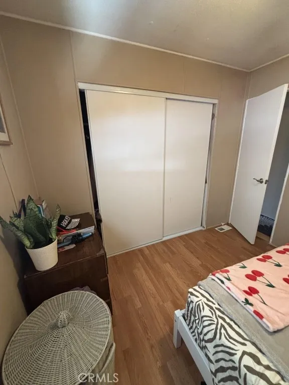 6550 Ponto, Unit 76 Carlsbad, CA 92011 - Photo 22 of 25 a bedroom with a bed window and couch