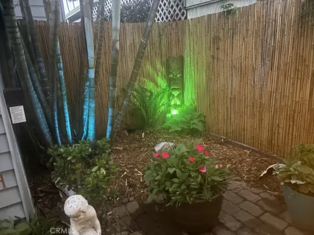 a living room with furniture a window and a flat screen tv