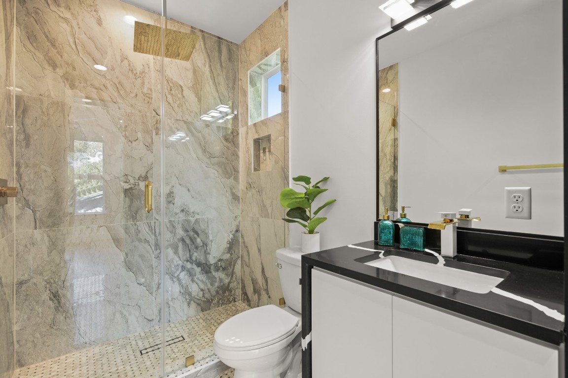 2902 Gonzales Street, Unit 2 Austin, TX 78702 - Photo 22 of 32 Bathroom with vanity and a marble finish shower