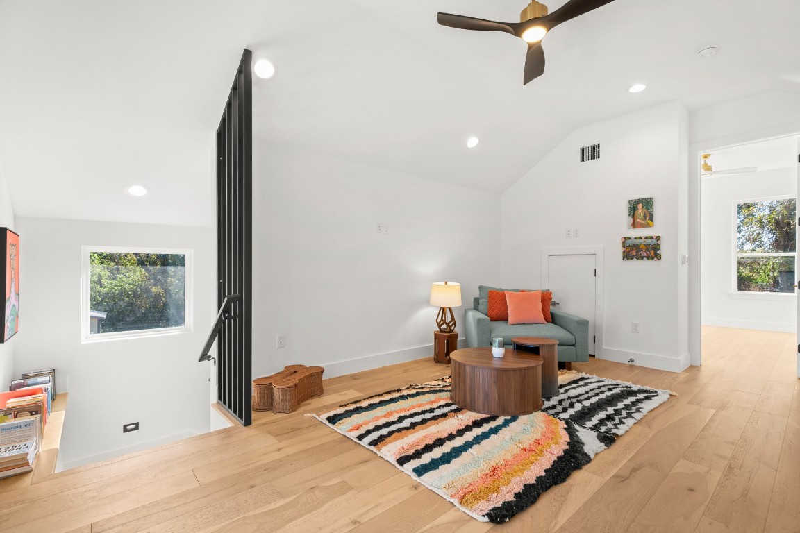 2902 Gonzales Street, Unit 2 Austin, TX 78702 - Photo 23 of 32 Top floor living area with light wood finished floors, recessed lighting, a ceiling fan, and high vaulted ceiling