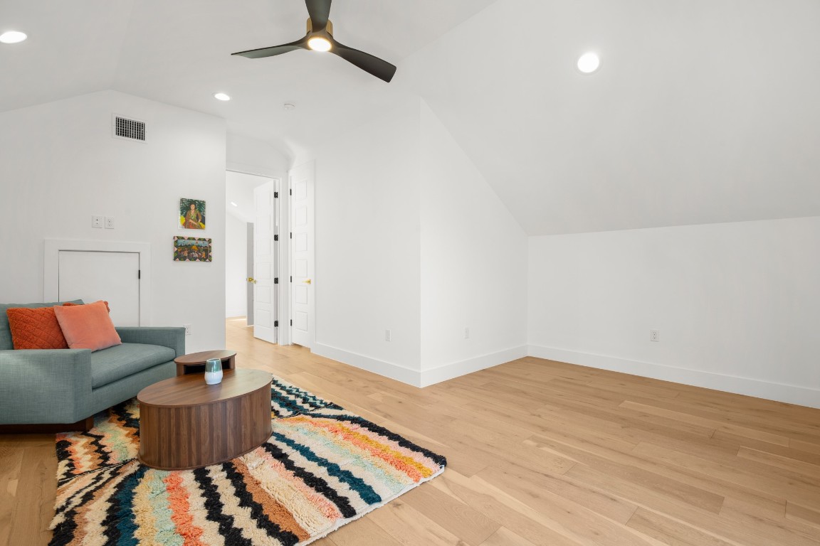 2902 Gonzales Street, Unit 2 Austin, TX 78702 - Photo 24 of 32 Additional living space featuring vaulted ceiling, recessed lighting, light wood-type flooring, and ceiling fan