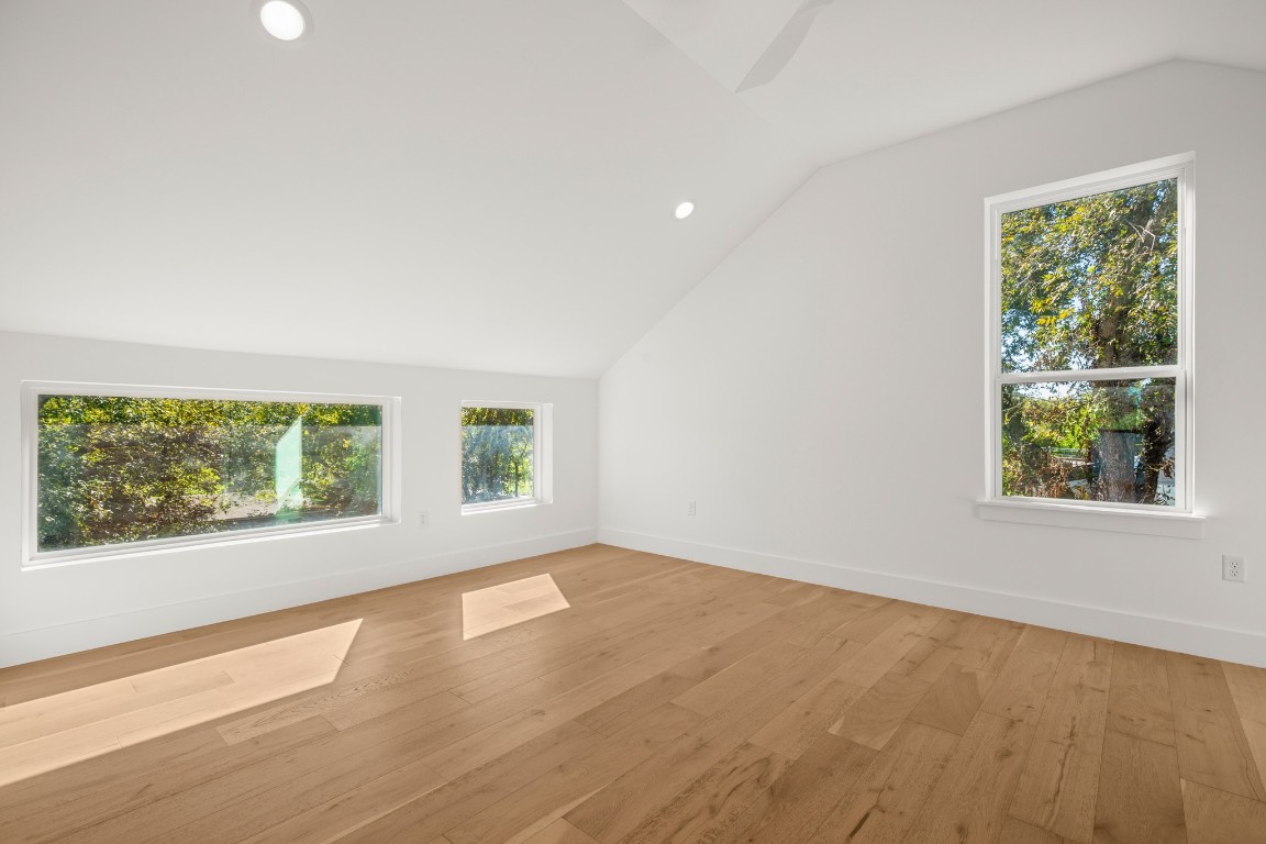2902 Gonzales Street, Unit 2 Austin, TX 78702 - Photo 25 of 32 Top floor suite with vaulted ceiling, recessed lighting, and light wood-style flooring