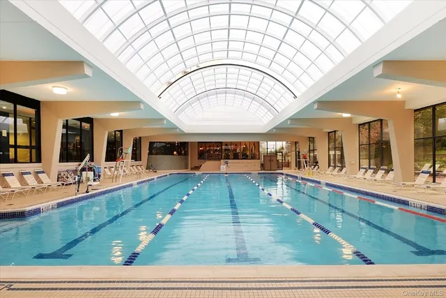a large hall with lots of dining table and sofas