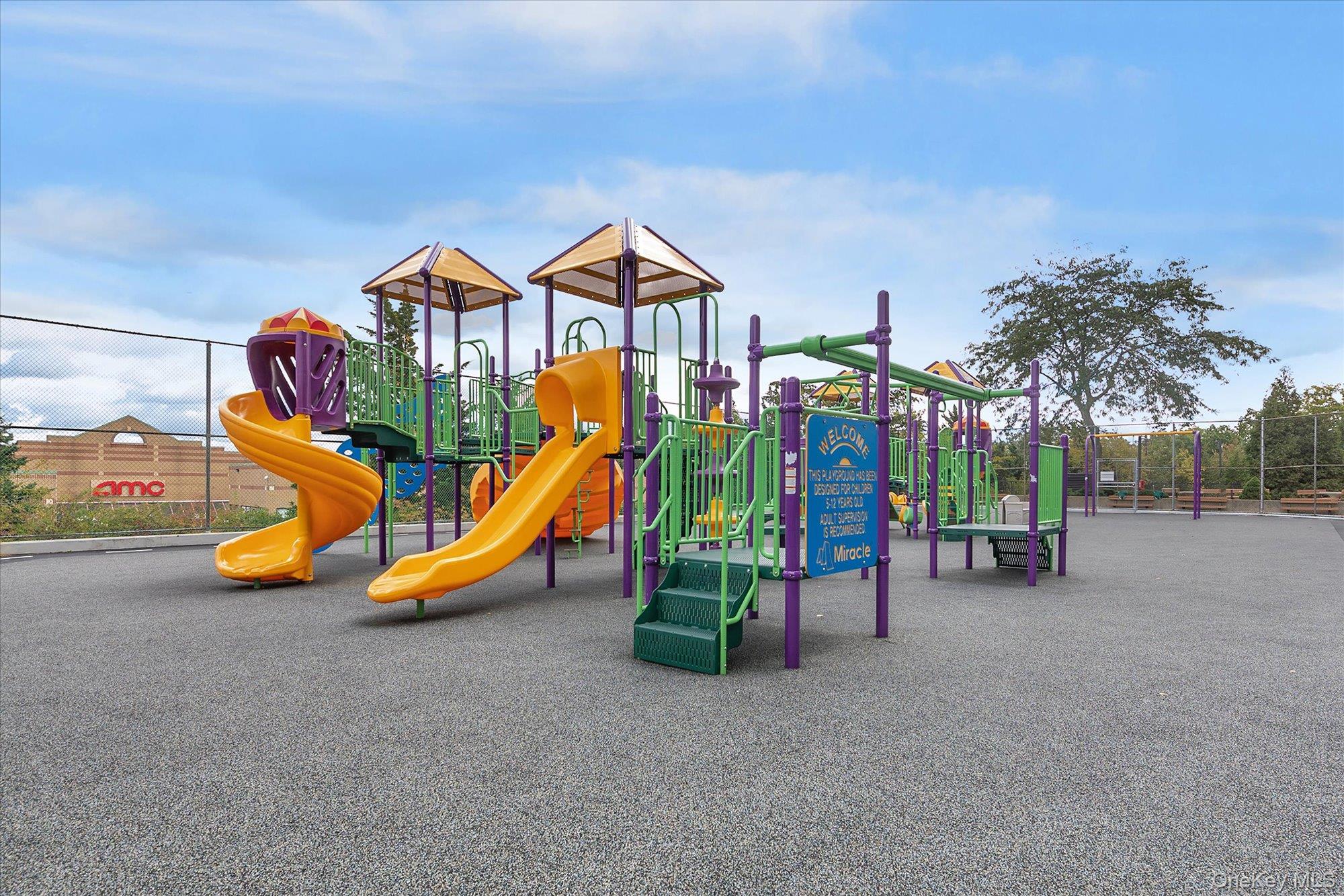 1 Bay Club Drive, Unit 8J Queens, NY 11360 - Photo 15 of 17 a view of a park with slide and table