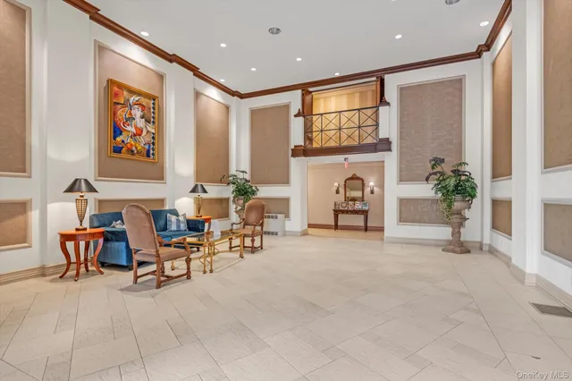 a view of a livingroom with furniture and a potted plant