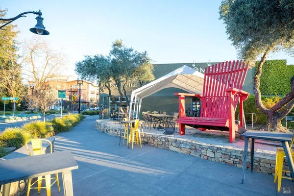 a view of a building with snow on the road