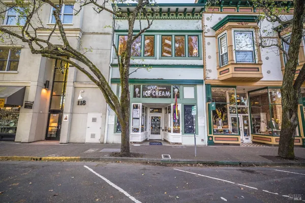 a view of a building with a parking space