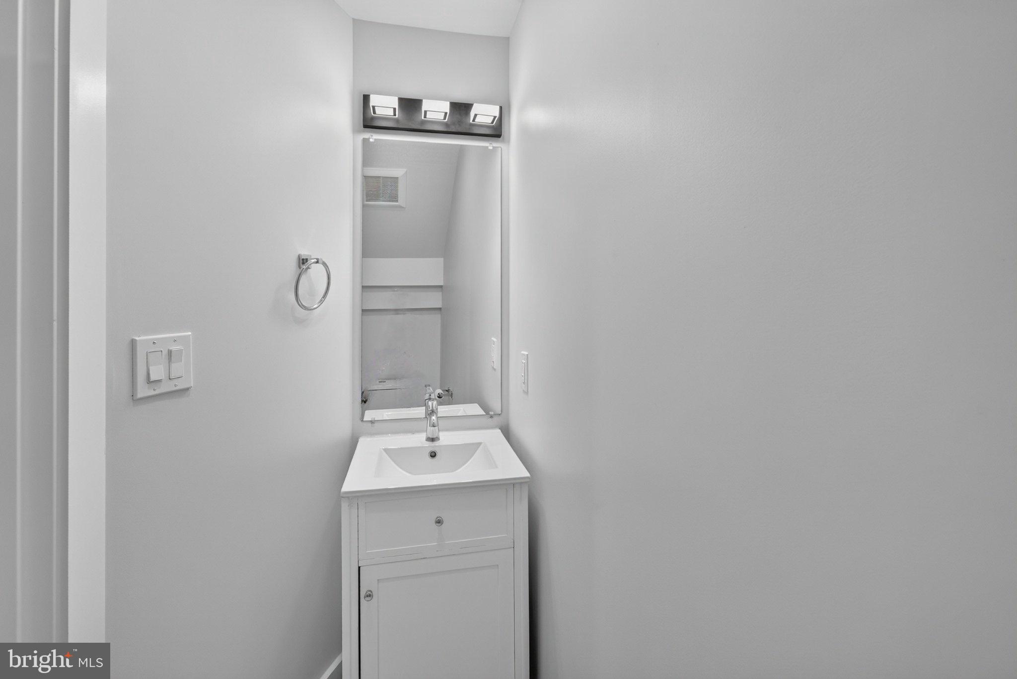 1650 Columbia Road Northwest, Unit 402 Washington, DC 20009 - Photo 8 of 19 Sleek and modern half-bath retreat.