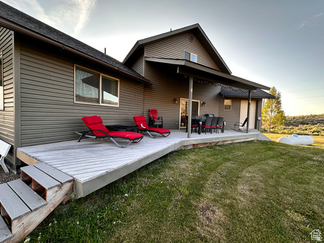 1940 East Shore Road St. Charles, ID 83272 - Photo 8 of 64 Rear view of house featuring a lawn and a patio