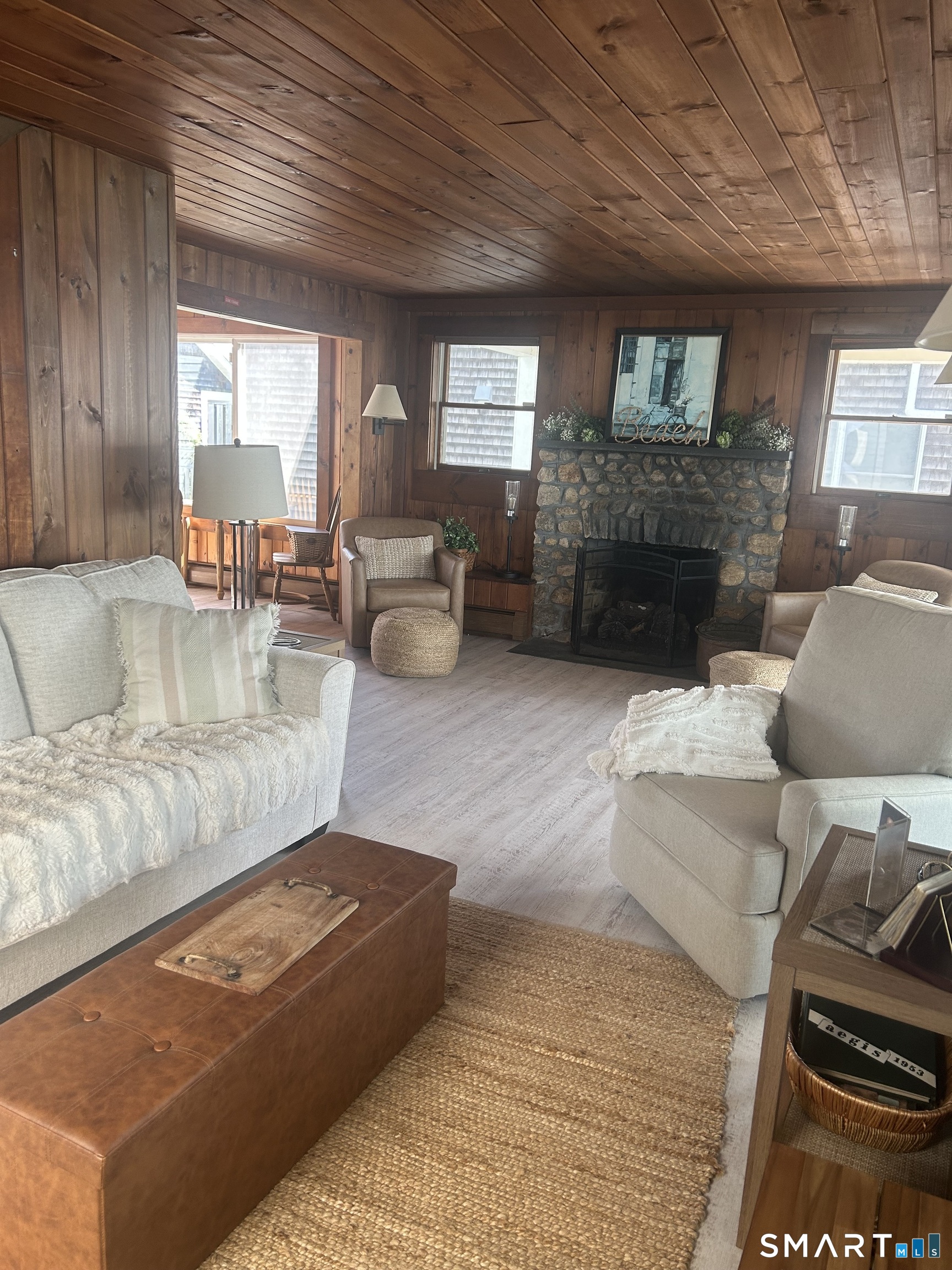 293 Giants Neck Road East Lyme, CT 06357 - Photo 12 of 21 Living room with fireplace and water views