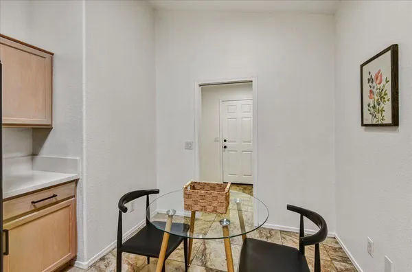 a view of a workspace with furniture