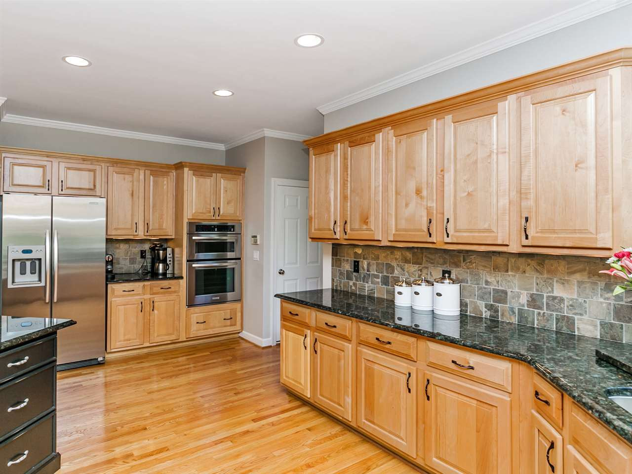 Kitchen Redesigned with New Granite, Cabinet Hardware, Under Cabinet Lighting and Recessed Lighting in Ceiling Kitchen