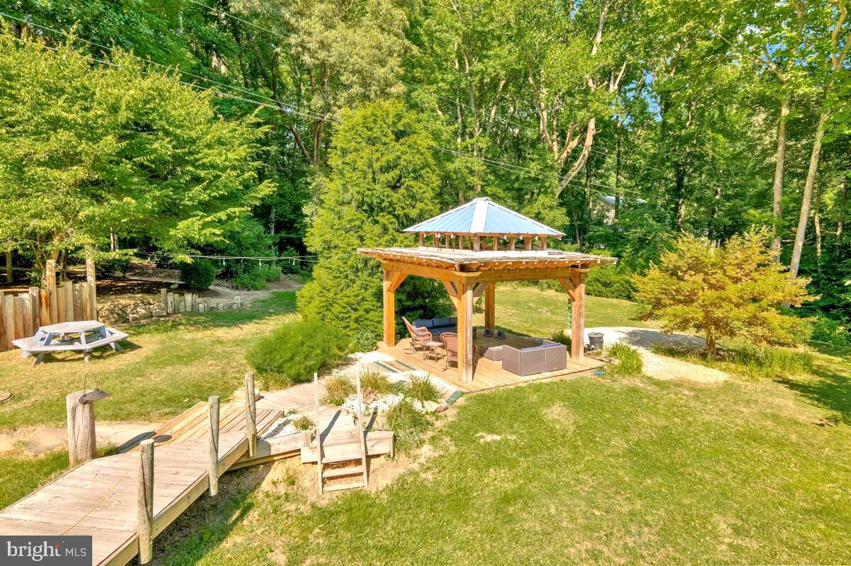 1620 Joe Harris Road Prince Frederick, MD 20678 - Photo 6 of 44 Raised walkway to pergola with lights for evening