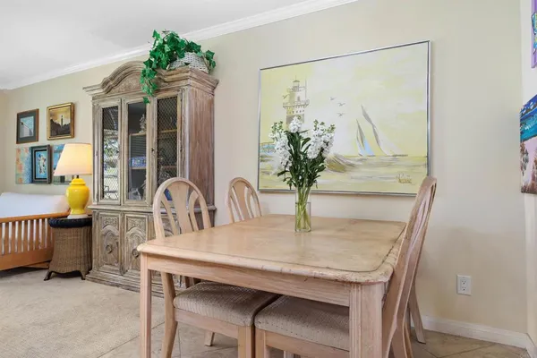 a dining room with furniture and window