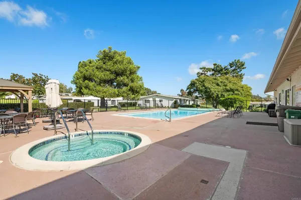 a view of a swimming pool with a patio